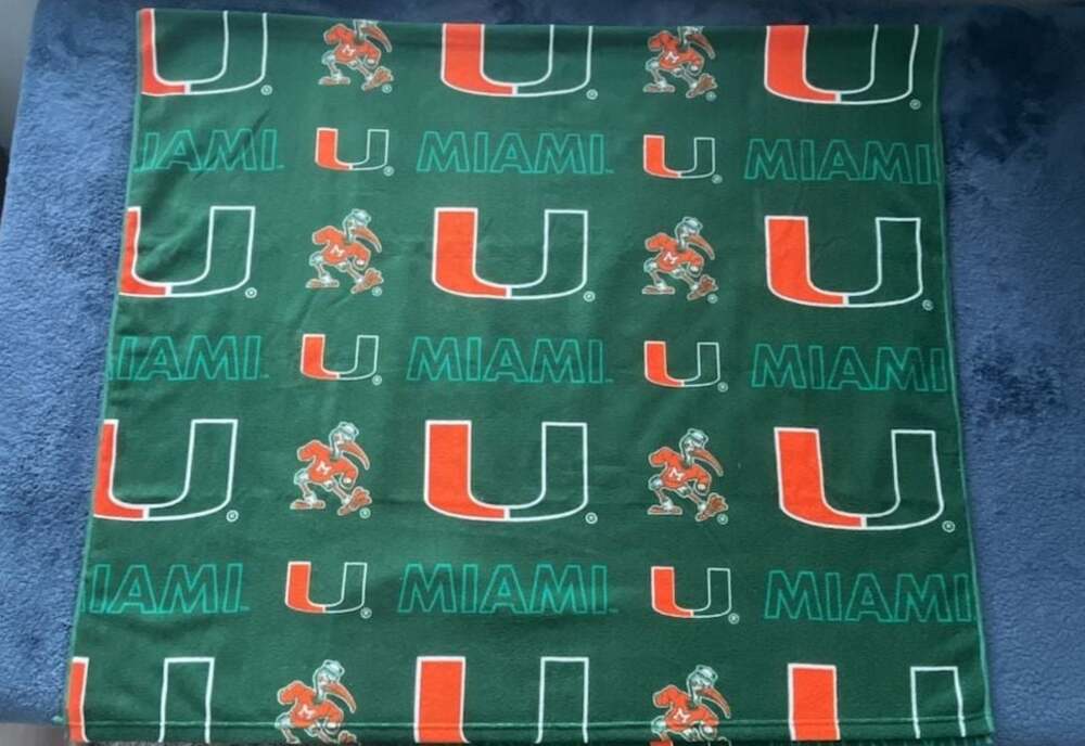 Pegasus University of Miami Hurricanes Repeat Logo Throw Blanket